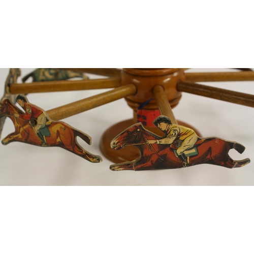 3024 - An early 20th century French parlour toy, the Grand Prix Merry Go Round Race Game, 42.5cm high, c.19... 