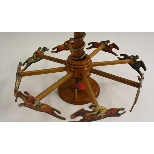 3024 - An early 20th century French parlour toy, the Grand Prix Merry Go Round Race Game, 42.5cm high, c.19... 