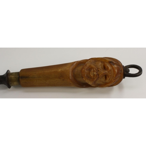 3065 - A 19th century novelty cutler's steel, the horn handle carved as the head of an Arab, 44cm long, c.1... 