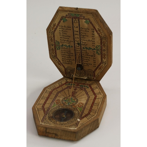 3133 - A dyptich portable compass sundial, printed papers and corded gnomon,10cm wide