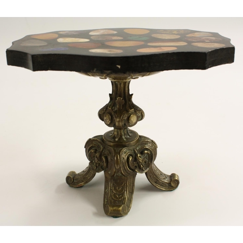 3155 - A Grand Tour type pietra dura and bronze miniature table, the serpentine top inlaid with pebble shap... 