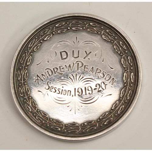 3310 - An early 20th century Scottish silver coloured metal medallion, Alloa Academy, the obverse struck wi... 