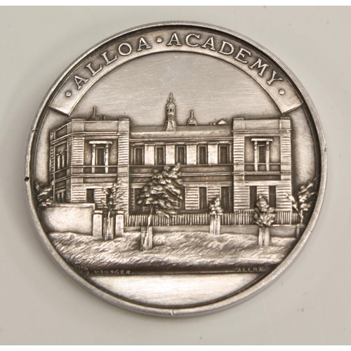 3310 - An early 20th century Scottish silver coloured metal medallion, Alloa Academy, the obverse struck wi... 