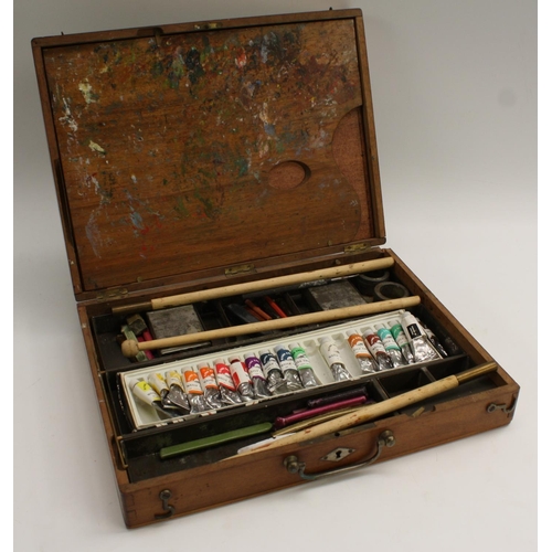 3321 - An Edwardian mahogany rectangular travelling artist's box, hinged cover enclosing a palette and an a... 