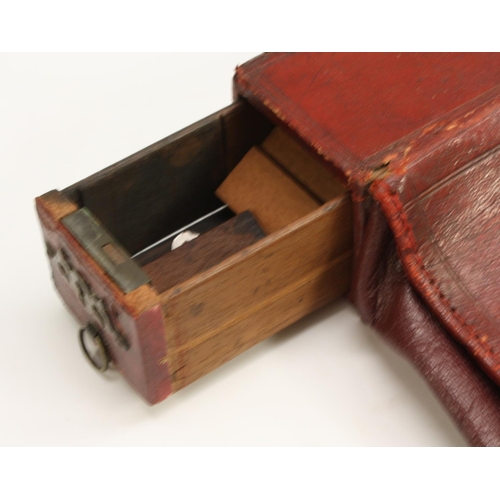 3341 - An unusual George III morocco leather dispatch case, hinged cover enclosing a marbled paper-lined in... 