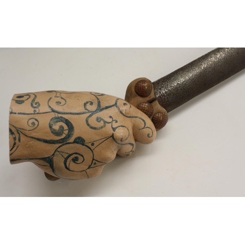 3345 - Arms and Armour - a pair of museum type display novelties, each as a hand grasping a sword, 72cm and... 