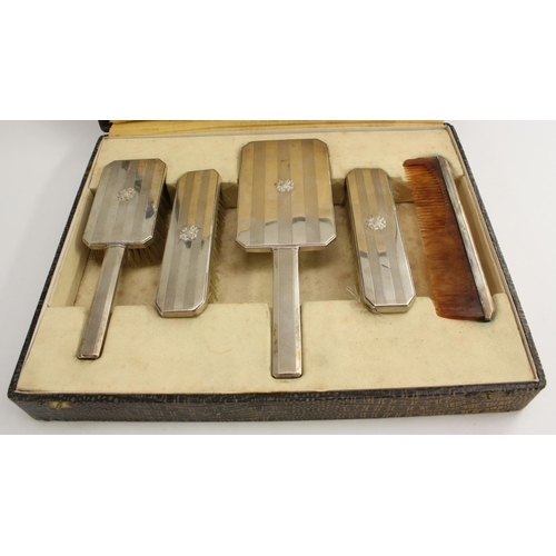 3400 - Nazi Germany and The Third Reich - a German silver five piece dressing table set, comprising hand mi... 