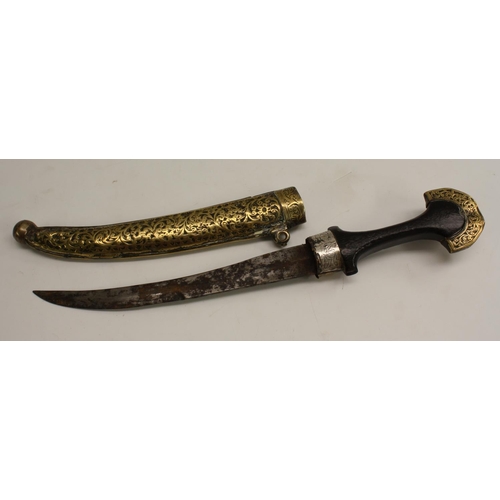 3483 - A Middle Eastern kindjahl dagger, 23cm curved blade, hardwood grip, the brass scabbard and mounts ch... 