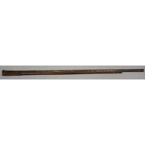 3488 - A substantial 19th century Indian matchlock rampart gun barrel, part hardwood stock, 188cm long