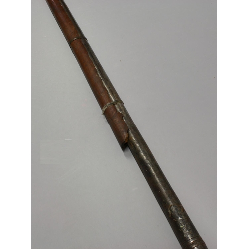 3488 - A substantial 19th century Indian matchlock rampart gun barrel, part hardwood stock, 188cm long