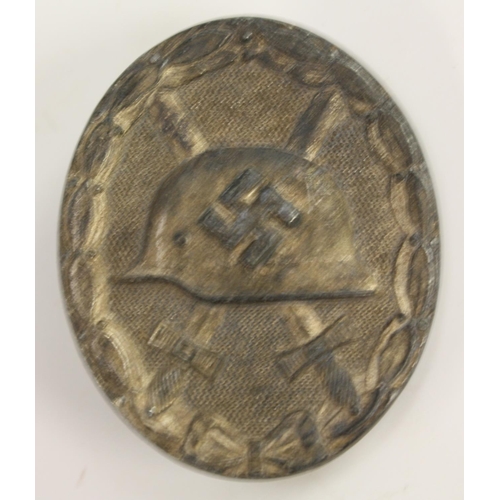 3503 - Nazism - a collection of Nazi German Third Reich badges and insignia, including an enamel NSDAP part... 