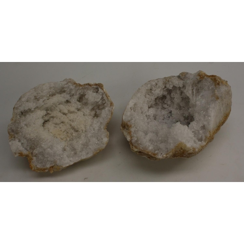 3509 - Geology - a bisected white quartz geode, cut to display matrix, 15cm wide