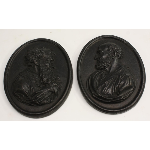 3648 - A pair of 19th century Grand Tour cast iron oval portrait plaques, in relief with gentlemen of learn... 