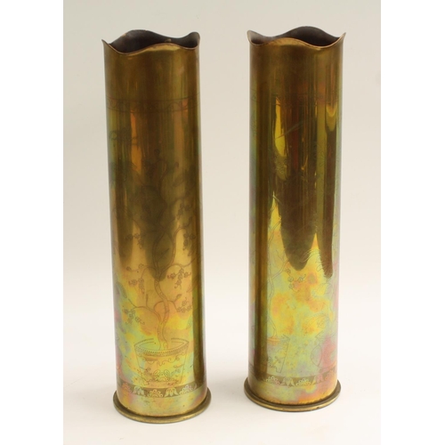 3649 - A pair of German World War One Trench Art mantel spill vases, each salvaged from a pair of Patronenf... 