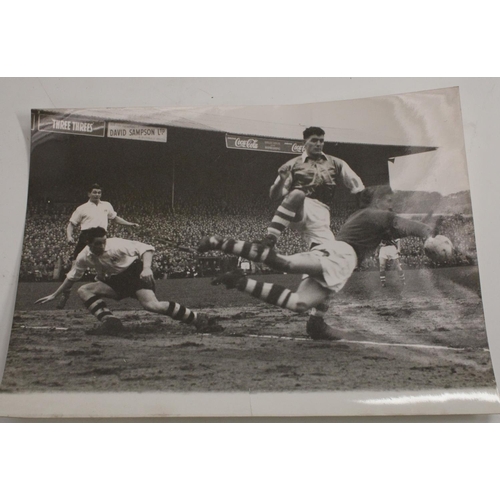 3460 - Football interest - a quantity of press photographs, 1957 season football action shots to include St... 