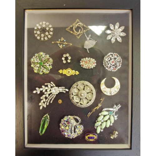 262 - Two wall hanging display boxes containing various brooches including a Victorian 9ct gold bar brooch... 