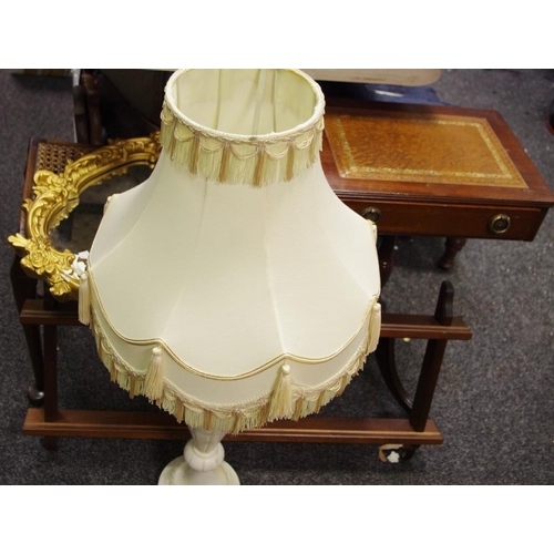 451 - A substantial alabaster lamp base; reproduction tooled leather inlaid occasional table; rattan piano... 