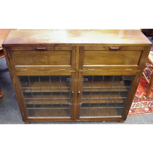 455 - A 1940's side cabinet, two fall front cupboards over two lead glazed doors