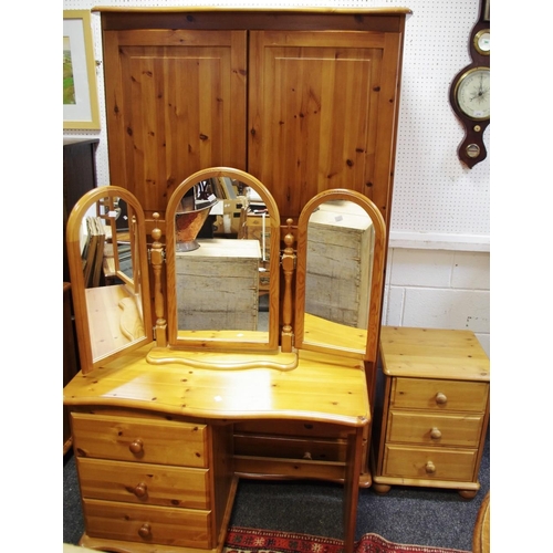 481 - A modern pine bedroom suite comprising a Duchers wardrobe, two doors over two long drawers, a Ducher... 