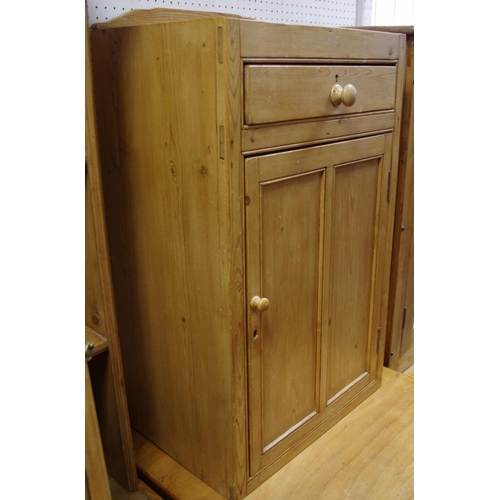 488 - An early 20th century pine utility cupboard, shaped gallery, single drawer over panel door cupboard,... 