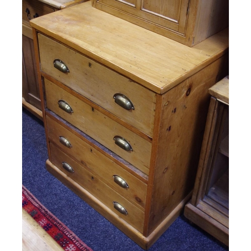 489 - A pine chest of four drawers, brass cup handles. 82cm high x 65cm wide x 63cm deep.