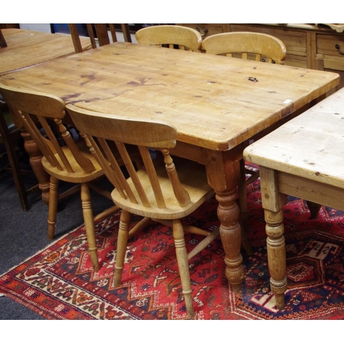 501 - A pine country kitchen table, plank top, single drawer to frieze, turned legs, four lath back dining... 