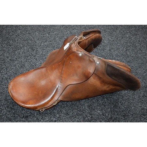 503 - A brown leather saddle