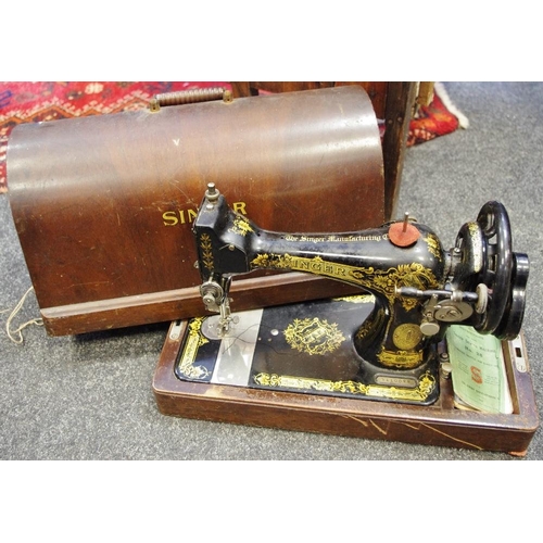 513 - A cased hand powered Singer sewing machine