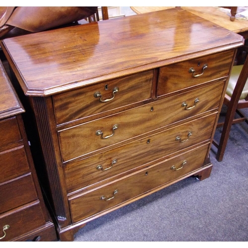 522 - A Regency mahogany chest of drawers, two short cockbeaded drawers over three graduated long flanked ... 