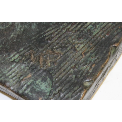 92 - Modern British School, a verdigris patinated bronze, of an artisan, rectangular base, signed in the ... 