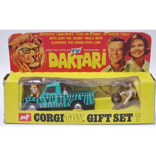 112 - Corgi GS7 ''Daktari'' Gift Set comprising of Land Rover (109wb) - green with black stripes, lemon in... 