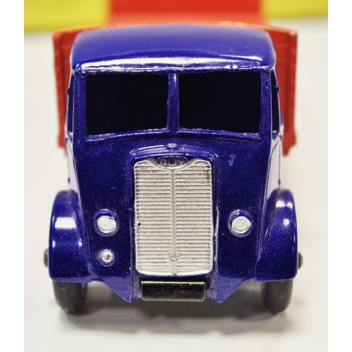 114 - Dinky 433 Guy Flat Truck with Tailboard - blue cab, chassis, orange back, mid-blue Supertoy hubs wit... 