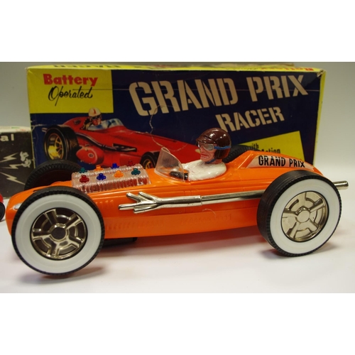 163 - A Ray's, Hong Kong large scale tinplate & plastic Grand Prix Racer, battery operated with mystery ac... 