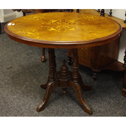 314 - A Victorian walnut and mahogany oval breakfast table, satinwood inlaid flora above four turned suppo... 