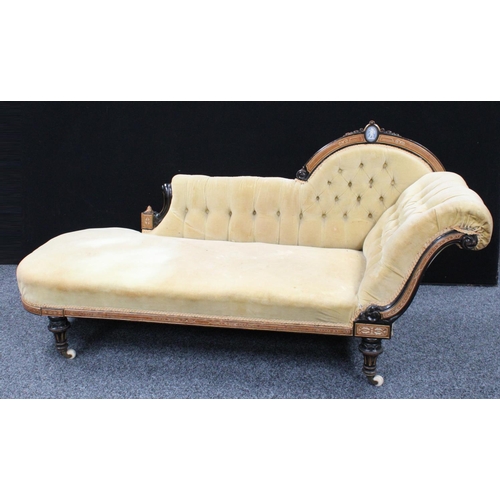 101 - A Victorian ebonised and parcel-gilt chaise longue/day bed, arched cresting rail centred by a Jasper... 