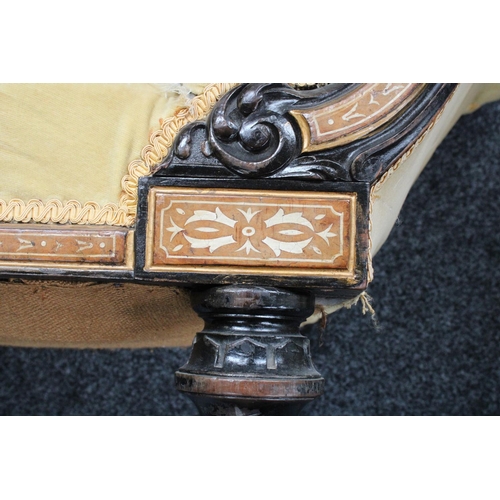 101 - A Victorian ebonised and parcel-gilt chaise longue/day bed, arched cresting rail centred by a Jasper... 