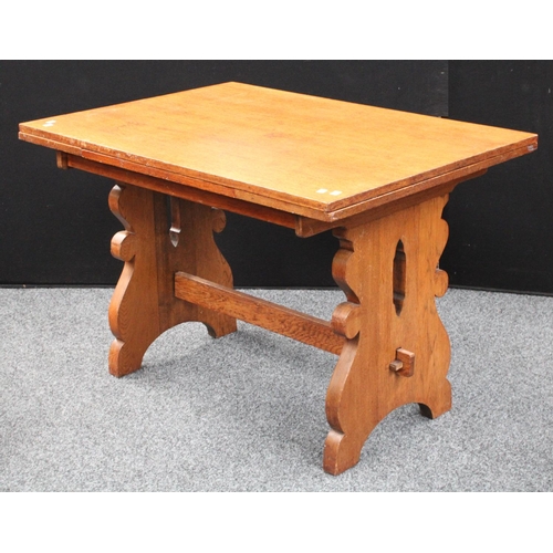 102 - An 'Arts & Crafts' oak drawerleaf dining table, well figured top with sliding leaves, shaped and pie... 