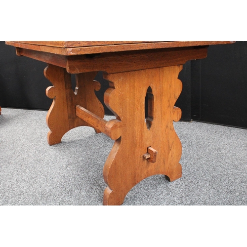 102 - An 'Arts & Crafts' oak drawerleaf dining table, well figured top with sliding leaves, shaped and pie... 