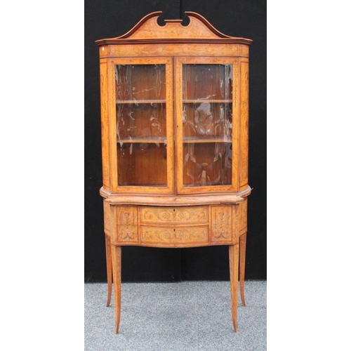 103 - A Sheraton Revival satinwood and marquetry serpentine display cabinet, break-arch pediment above a p... 