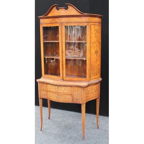 103 - A Sheraton Revival satinwood and marquetry serpentine display cabinet, break-arch pediment above a p... 