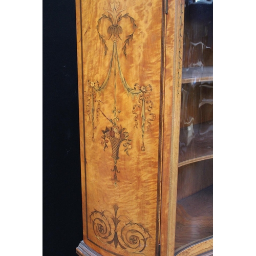 103 - A Sheraton Revival satinwood and marquetry serpentine display cabinet, break-arch pediment above a p... 