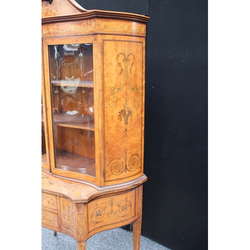 103 - A Sheraton Revival satinwood and marquetry serpentine display cabinet, break-arch pediment above a p... 