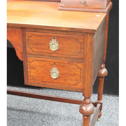 104 - An early 20th century mahogany dressing table, arched superstructure with adjustable mirror above tw... 