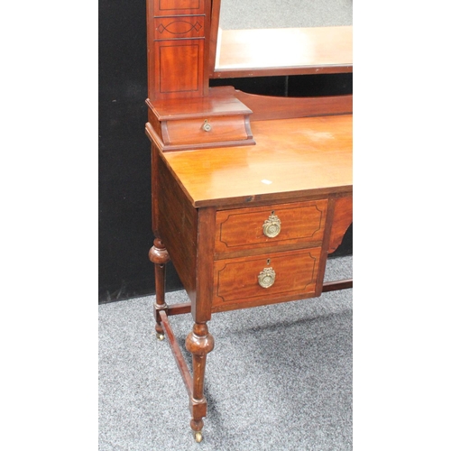 104 - An early 20th century mahogany dressing table, arched superstructure with adjustable mirror above tw... 