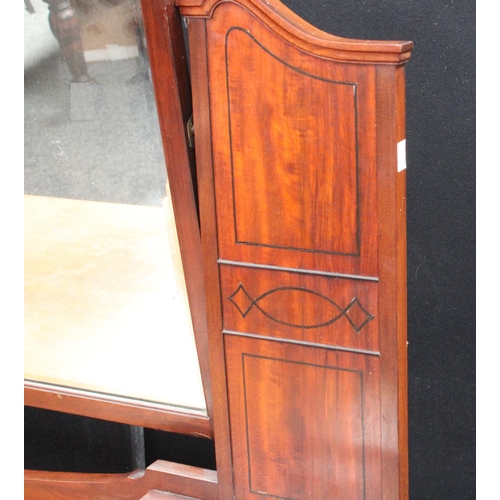 104 - An early 20th century mahogany dressing table, arched superstructure with adjustable mirror above tw... 