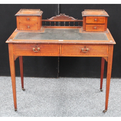 109 - An Edwardian mahogany writing table/desk, rectangular top with inset writing surface and two banks o... 