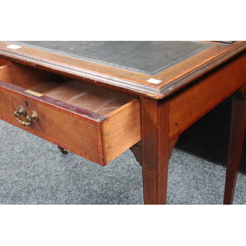 109 - An Edwardian mahogany writing table/desk, rectangular top with inset writing surface and two banks o... 