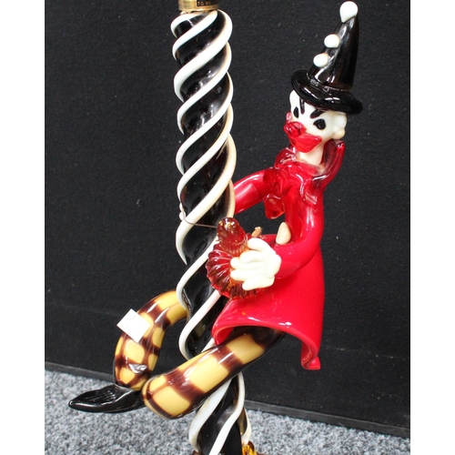 143 - A large glass Murano glass table lamp as a man under a lampost