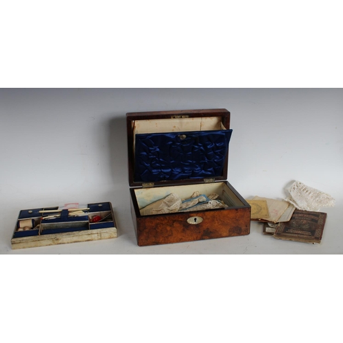145 - A Victorian walnut rectangular work box, fitted interior enclosing a collection of conforming appurt... 