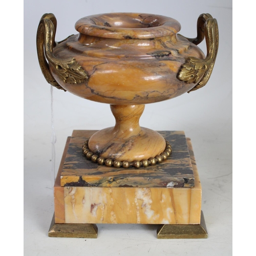 148 - A 19th century Neoclassical Revival gilt-metal mounted Sienna Marble mantel clock garniture, the dru... 